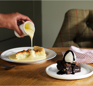 Table Table dessert menu items of chocolate brownie with vanilla ice cream and caramel apple cake with custard.