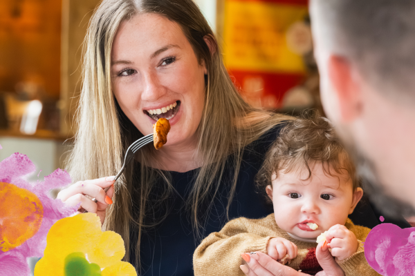 mum and child enjoying a roast dinner at a table table